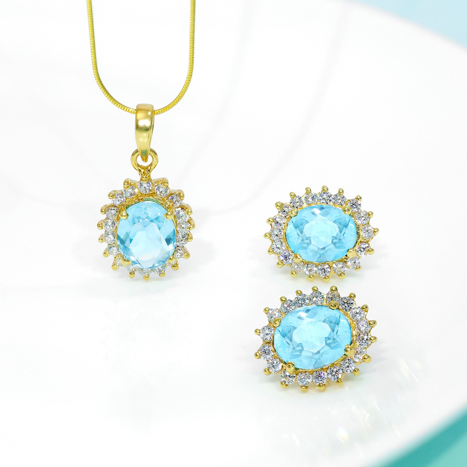 Gold Plated Silver Sky Blue Stone Studded Pendant & Earrings Set - Tweov Jewels