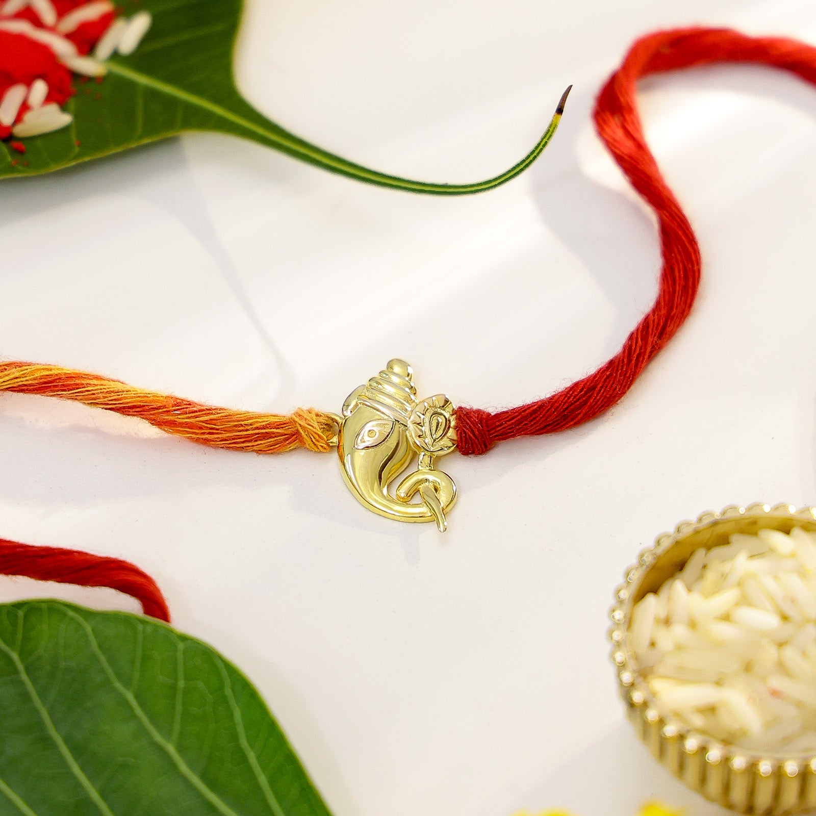 Gold Plated Lotus Holding Designer Ganesha Silver Rakhi - Tweov Jewels
